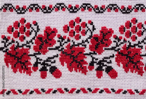 Fototapeta Ukrainian embroidery by cross-stitch. Handmade. Ethnic wedding ornament.