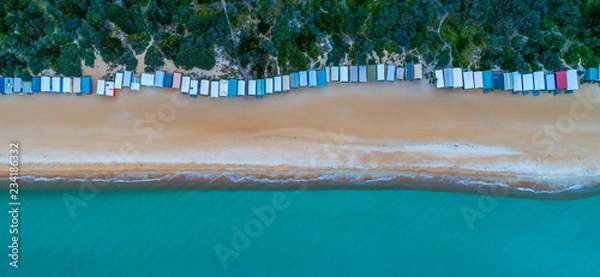 Fototapeta Aerial panorama of long row of beach huts and beautiful turquoise water in Melbourne, Australia