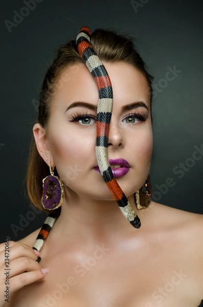 Fototapeta Perfect portrait sensual woman and king snake in the studio.