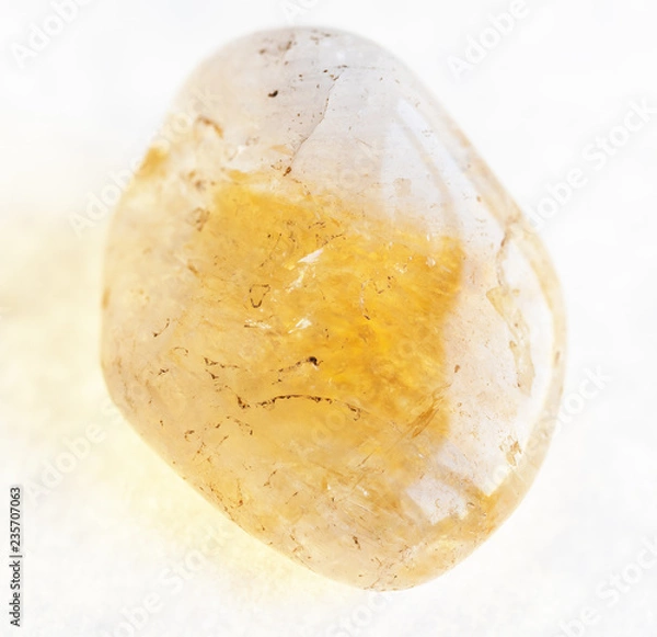 Obraz polished Citrine (yellow quartz) gemstone on white