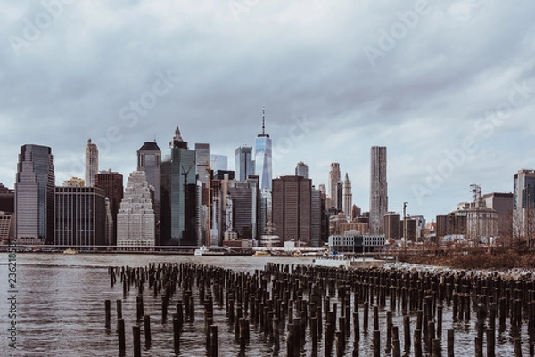 Fototapeta View of the Manhattan skyline from Brooklyn Heights, New York. Cloudy spring day