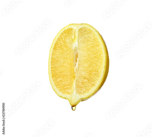 Fototapeta Essential oil dripping from lemon cut on white background