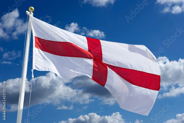 Fototapeta ENGLISH RED AND WHITE CROSS OF SAINT GEORGE FLAG WITH BLUE SKY AND WHITE CLOUDS