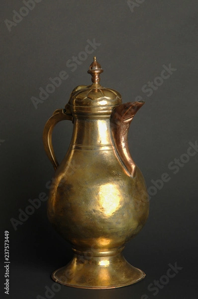 Obraz ancient oriental metal teapot on dark background. antique bronze tableware