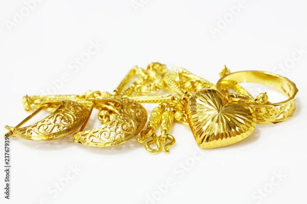 Fototapeta Gold jewelry on white background.