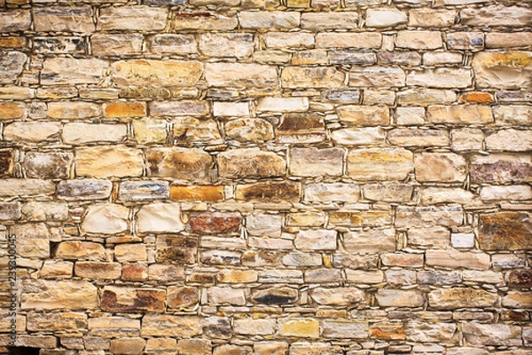 Fototapeta Stone brick wall of one of the houses on the island of Cyprus