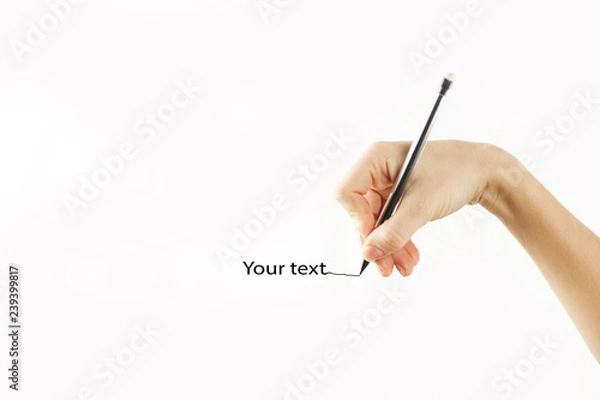 Obraz Girl's hand writes in empty space isolated on background