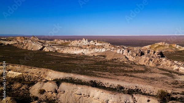 Fototapeta Panorama view to Aral sea from the rim of Plateau Ustyurt at sunset , Karakalpakstan, Uzbekistan