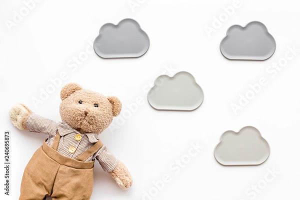 Fototapeta Handmade toys for newborn baby. Teddy bear. White background top view