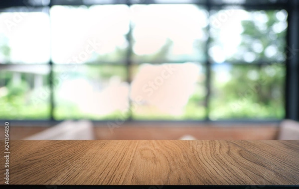 Fototapeta Empty dark wooden table in front of abstract blurred bokeh background of restaurant . can be used for display or montage your products.Mock up for space.