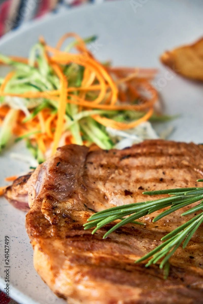 Fototapeta grilled beef steak with vegetables on plate