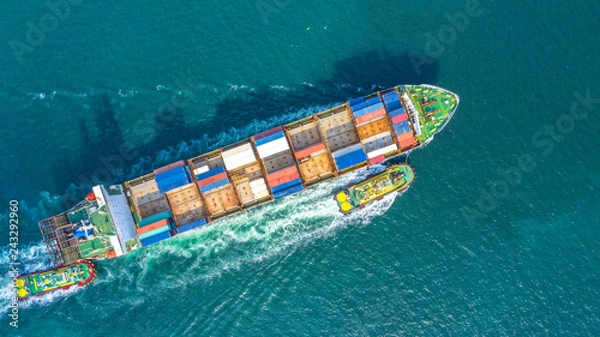 Obraz Container ship in export and import business logistics and transportation. Cargo and container box shipping to harbor by crane. Water transport International. Aerial view and top view.