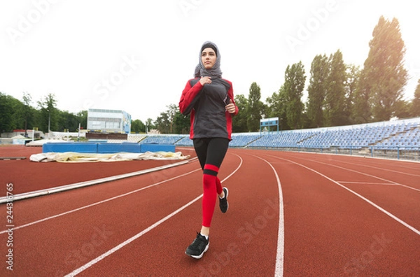 Fototapeta Arabian girl running on stadium