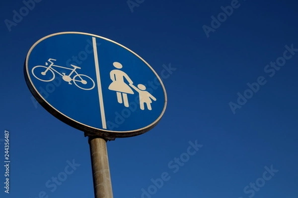 Fototapeta Blue traffic sign on blue sky