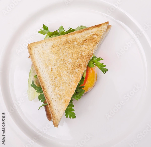 Fototapeta fried toast with egg, greens, salad, red pepper closeup