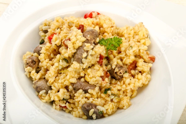 Fototapeta Bulgur with chicken hearts