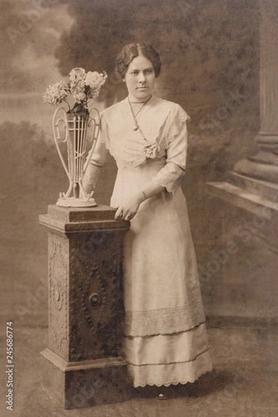 Fototapeta RUSSIA - CIRCA 1905-1910: A portrait of young woman in studio, Vintage Carte de Viste Edwardian era photo