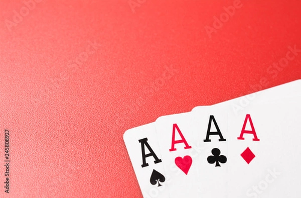 Fototapeta four ace playing cards on red background