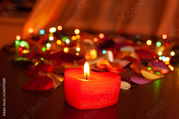 Fototapeta red candles in the shape of heart