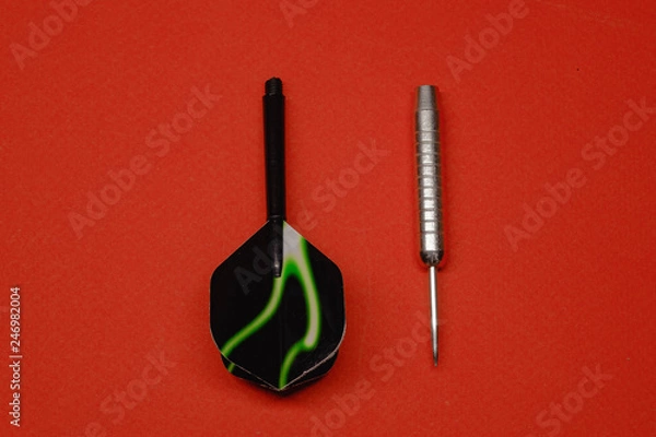 Fototapeta two darts for darts on a red background