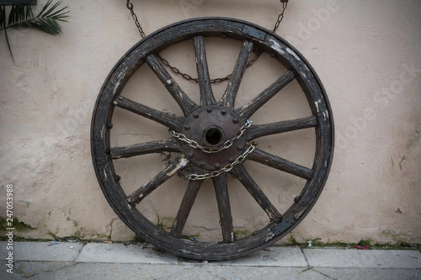 Fototapeta Old Towing Wheel Chained with Chains