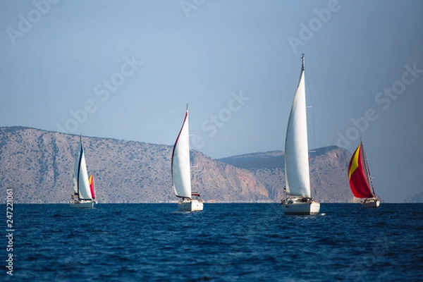 Fototapeta Adventure and luxury holiday. Sailing boats in the sail yacht regatta at Aegean Sea.