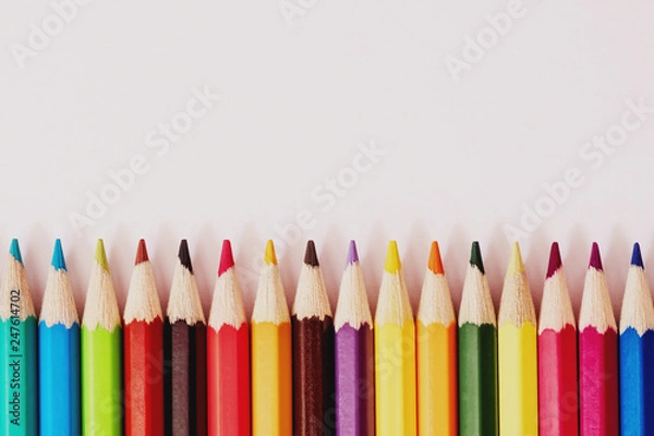 Fototapeta row of crayons on a white background