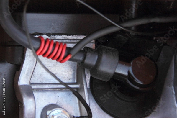 Fototapeta High-voltage wire and spark plug cap of single-cylinder engine, tachometer connection