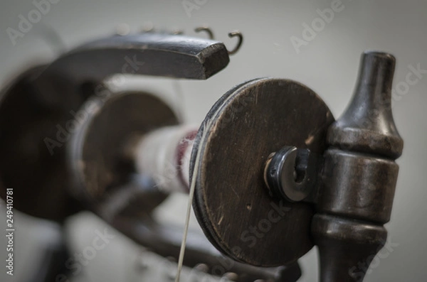 Fototapeta Close up of a spinning wheel spool with yarn