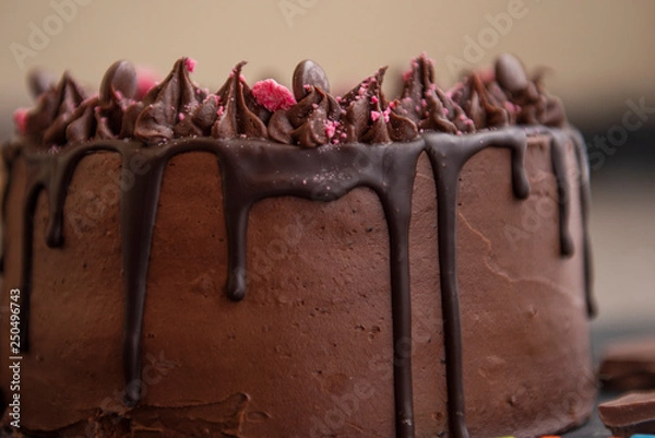 Fototapeta close up detail of chocolate birthday cake 