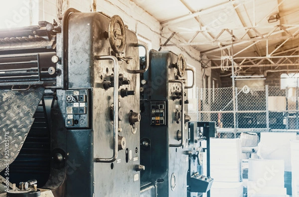 Fototapeta Old vintage printing machine in the print shop. Magazine, newspaper, brochure, paint.