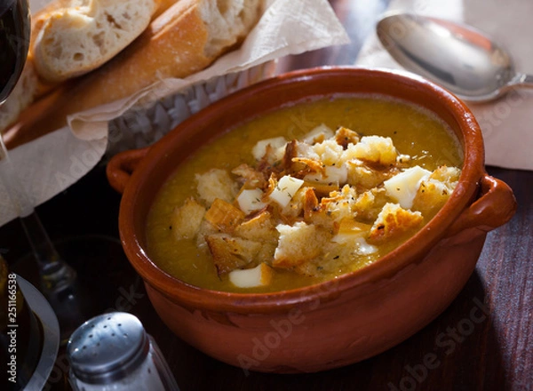 Fototapeta Cream soup with croutons and cheese