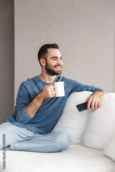 Fototapeta Attractive young man relaxing