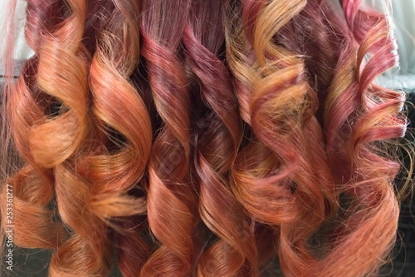 Obraz Background of bright curled locks of long hair with glitter from crimson to red.