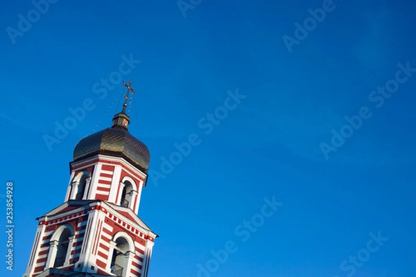 Fototapeta Ukrainian Orthodox Church Bell Tower. Bird Sitting on Top of the Cross