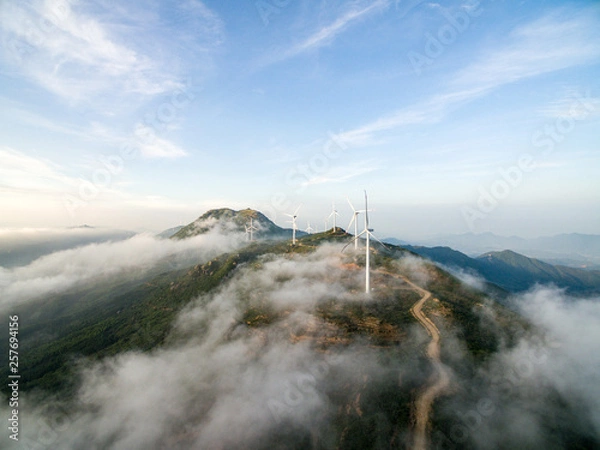 Fototapeta Wind power generator before sunrise sunset ，Wind power generation in the sea of clouds