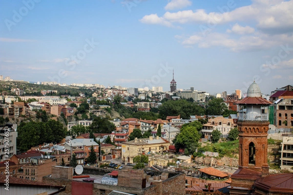 Fototapeta View of the city from the observation deck. The capital of Georgia is Tbilisi. Old city. The Kura River. Red roofs, low buildings. Panorama, architecture, urban