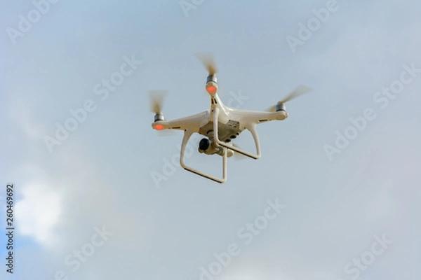 Fototapeta Quadcopter drone in the sky