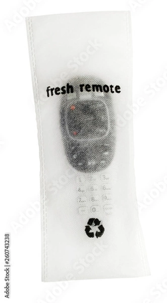 Fototapeta Hotel TV remote packaged in germ-free sanitized wrapping.