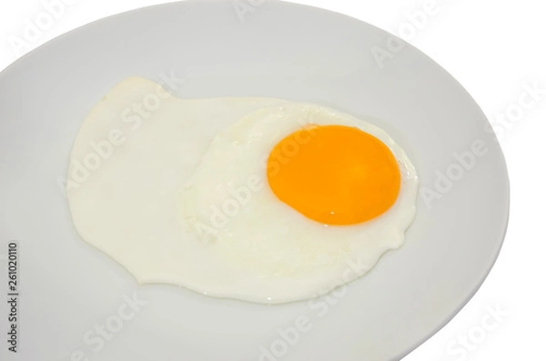 Fototapeta fried egg in a white plate on a white background