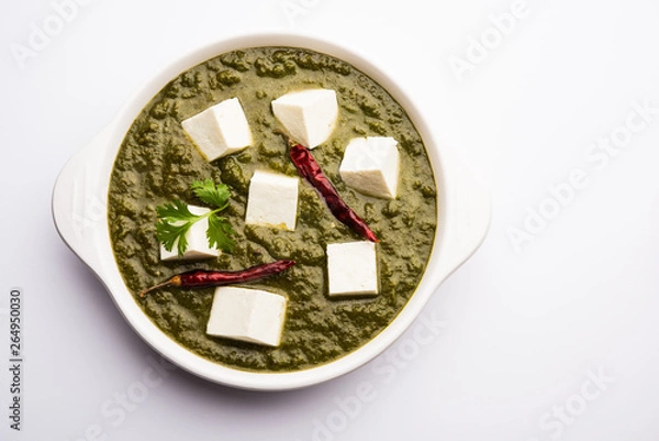 Fototapeta Palak Paneer Curry made up of spinach and cottage cheese served in a bowl. selective focus