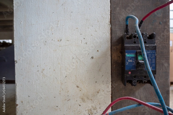 Fototapeta Circuit breaker install on wall with cables connect to machine , copy space