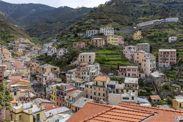 Fototapeta RIOMAGGIORE, LIGURIA/ITALY  - APRIL 21 : View of Riomaggiore Liguria Italy on April 21, 2019. Unidentified people