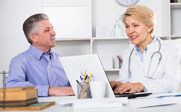 Fototapeta Mature man visits doctor