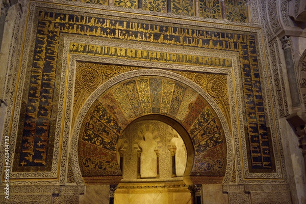 Fototapeta Mihrab with gold mosaic design and caligraphy at the Prayer Hall of the Cordoba Cathedral Mosque