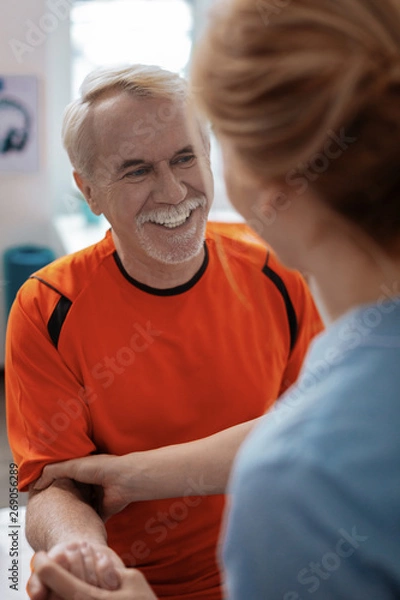 Fototapeta Delighted aged man being in a positive mood