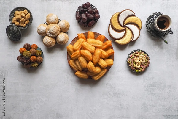 Fototapeta Ramadan sweets are laid out on the table. Top view