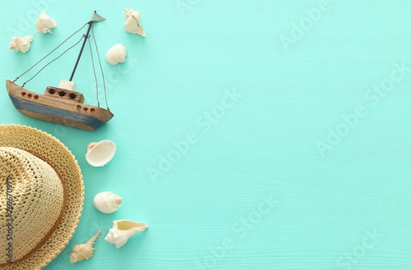 Fototapeta Tropical vacation and summer travel image with sea life style objects over pastel mint blue background. Top view