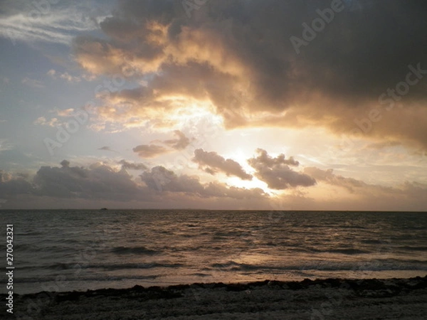 Fototapeta clouds and the beach