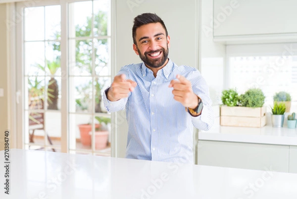 Fototapeta Handsome hispanic business man Pointing to you and the camera with fingers, smiling positive and cheerful